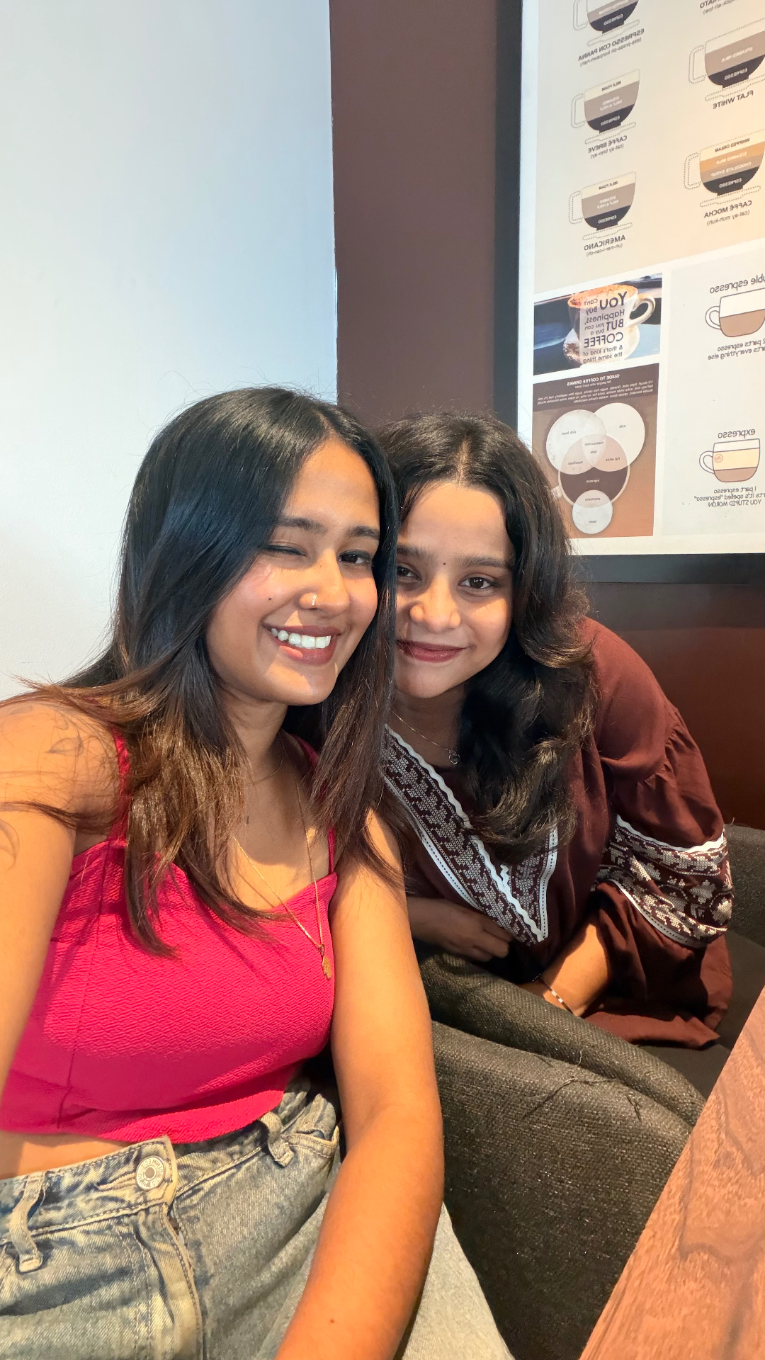 Aswathy with a friend at a coffee shop